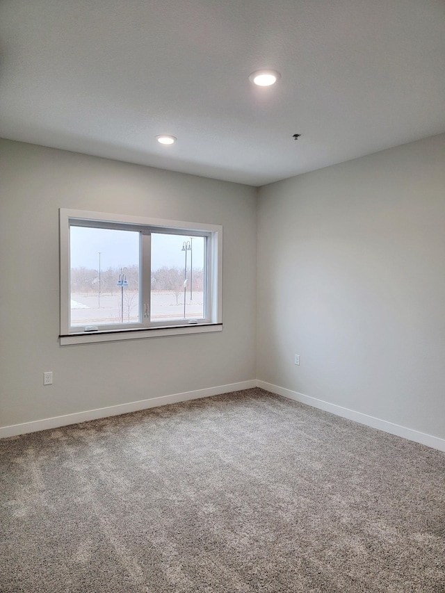 715 Lake Shore Dr NE Unit 105, Bemidji, MN 56601 - carpeted empty room with recessed lighting and baseboards