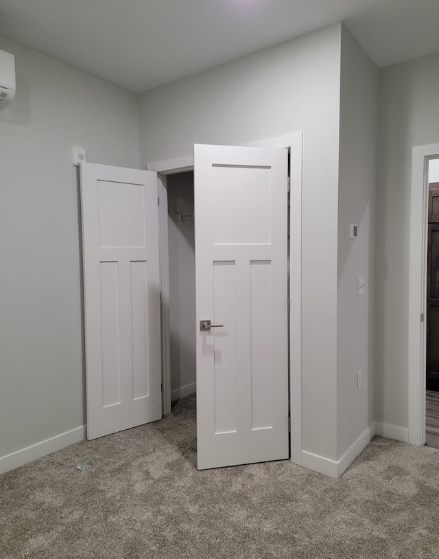 715 Lake Shore Dr NE Unit 105, Bemidji, MN 56601 - unfurnished bedroom featuring carpet flooring and baseboards