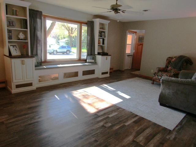 318 3rd St, Dawson, MN 56232 - unfurnished living room with dark wood-style flooring and ceiling fan