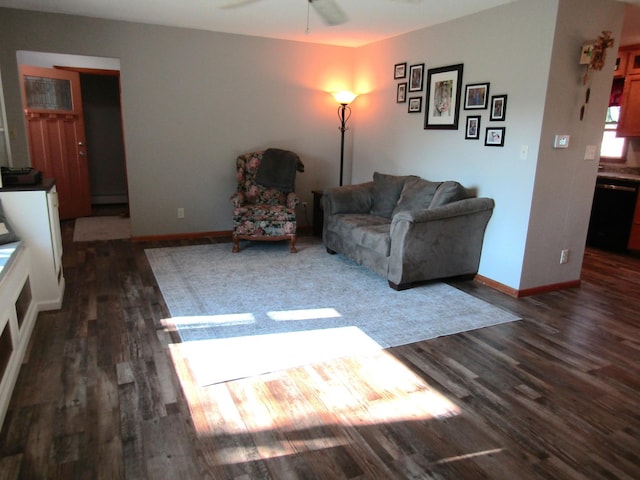 318 3rd St, Dawson, MN 56232 - living room featuring dark wood-style flooring, a ceiling fan, and baseboards