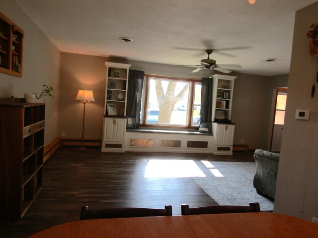 318 3rd St, Dawson, MN 56232 - living area with healthy amount of natural light, dark wood-style floors, and a ceiling fan