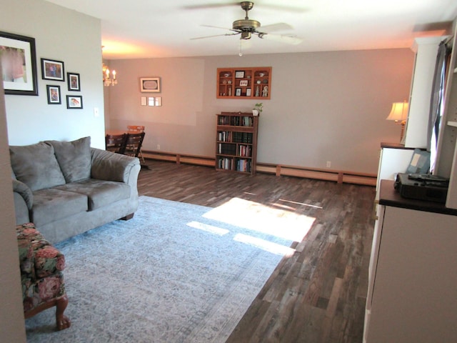 318 3rd St, Dawson, MN 56232 - living area featuring a baseboard radiator, wood finished floors, a ceiling fan, and a chandelier