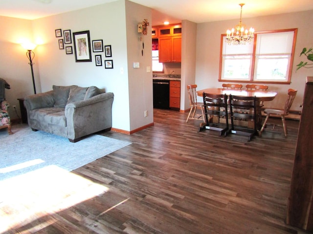 318 3rd St, Dawson, MN 56232 - living room featuring a chandelier, dark wood-style flooring, and baseboards