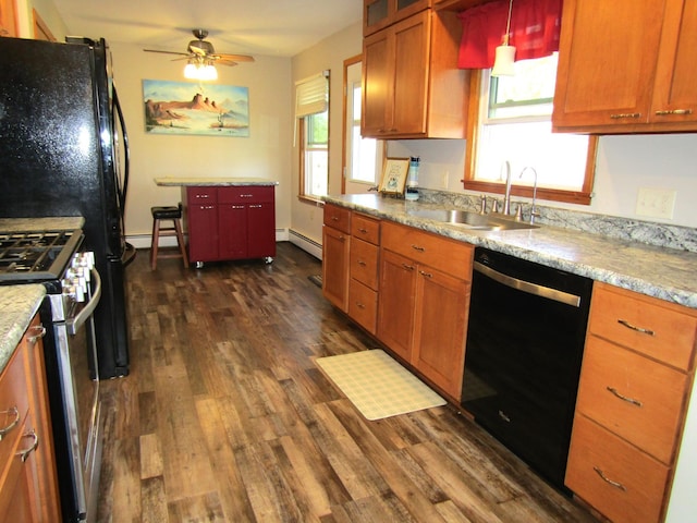 318 3rd St, Dawson, MN 56232 - kitchen with dishwasher, stainless steel gas stove, a baseboard radiator, a sink, and dark wood-type flooring