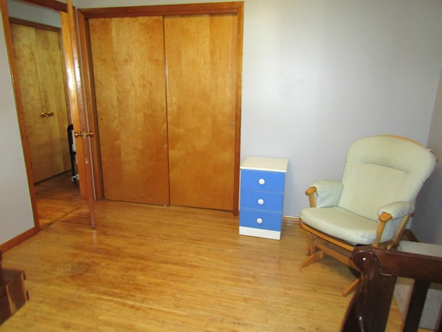 318 3rd St, Dawson, MN 56232 - living area with light wood-type flooring and baseboards