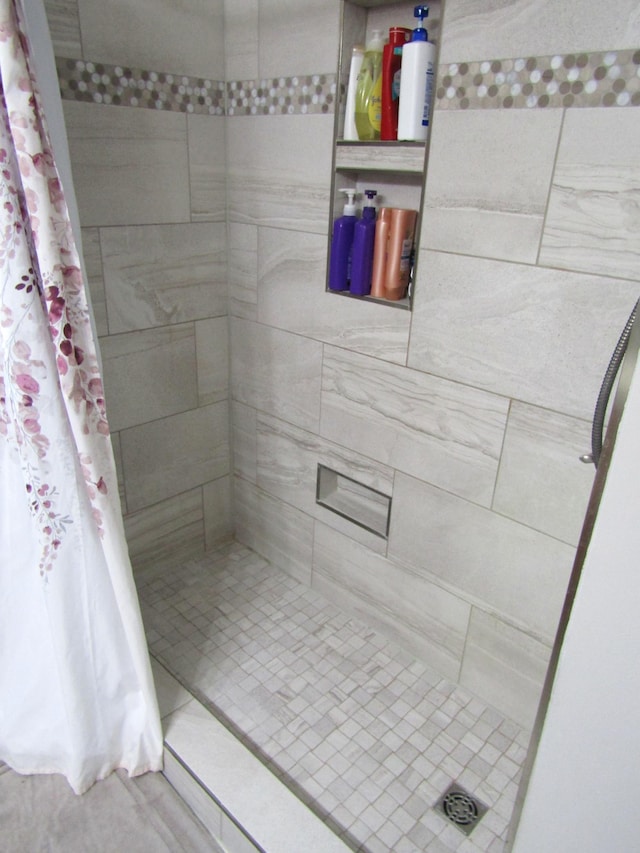 318 3rd St, Dawson, MN 56232 - bathroom with tiled shower and tile patterned flooring