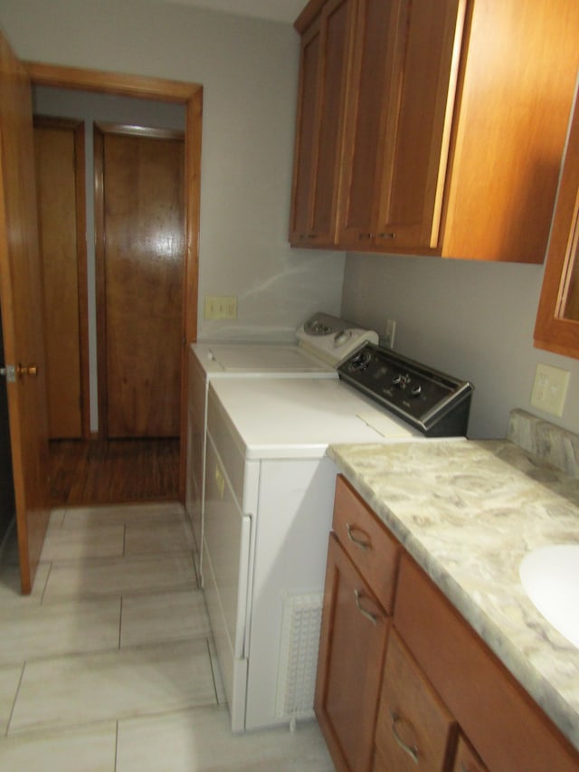 318 3rd St, Dawson, MN 56232 - laundry room with washing machine and clothes dryer and cabinet space