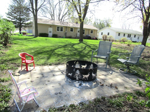 318 3rd St, Dawson, MN 56232 - view of patio featuring a fire pit