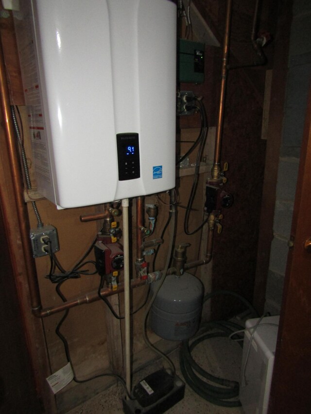 318 3rd St, Dawson, MN 56232 - utility room with tankless water heater