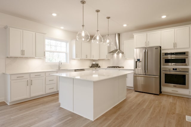 15710 112th Ave N, Dayton, MN 55369 - kitchen with appliances with stainless steel finishes, wall chimney range hood, a sink, white cabinetry, and recessed lighting