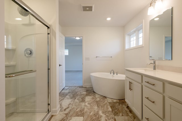 15710 112th Ave N, Dayton, MN 55369 - full bath with vanity, a stall shower, marble finish flooring, a soaking tub, and baseboards
