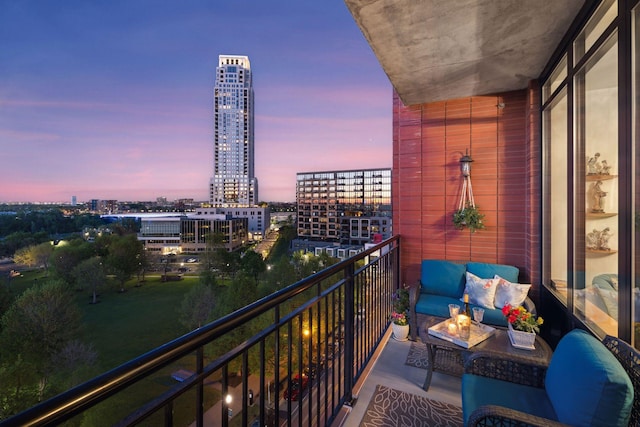 215 10th Ave S Unit 812, Minneapolis, MN 55415 - balcony at dusk featuring a view of city and an outdoor living space