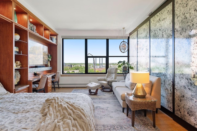 215 10th Ave S Unit 812, Minneapolis, MN 55415 - bedroom with a baseboard heating unit and wood finished floors