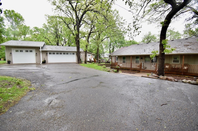 5151 99th Ave, Clear Lake, MN 55319 - view of front of home with a garage, driveway, and a porch