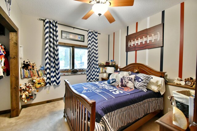 5151 99th Ave, Clear Lake, MN 55319 - bedroom with light carpet, baseboards, a textured ceiling, and a ceiling fan