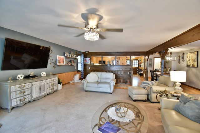 5151 99th Ave, Clear Lake, MN 55319 - living room featuring wooden walls, ceiling fan, a wainscoted wall, and carpet flooring