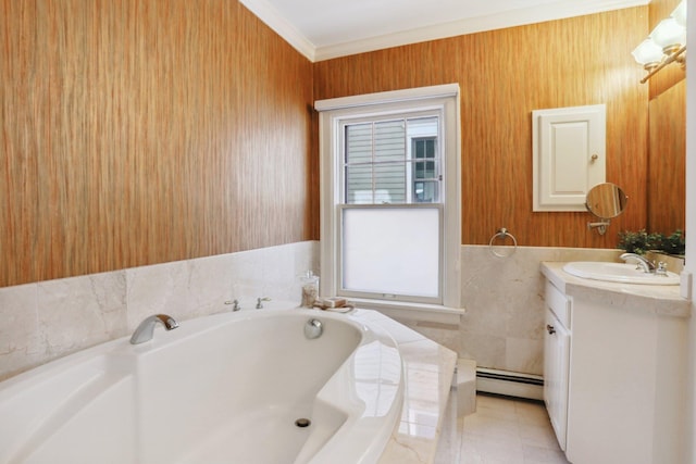bathroom featuring baseboard heating, vanity, a bath, crown molding, and tile walls