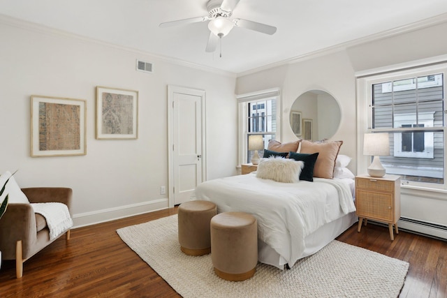 bedroom with ornamental molding, wood finished floors, baseboards, and a ceiling fan