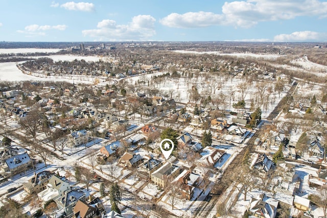 snowy aerial view with a residential view