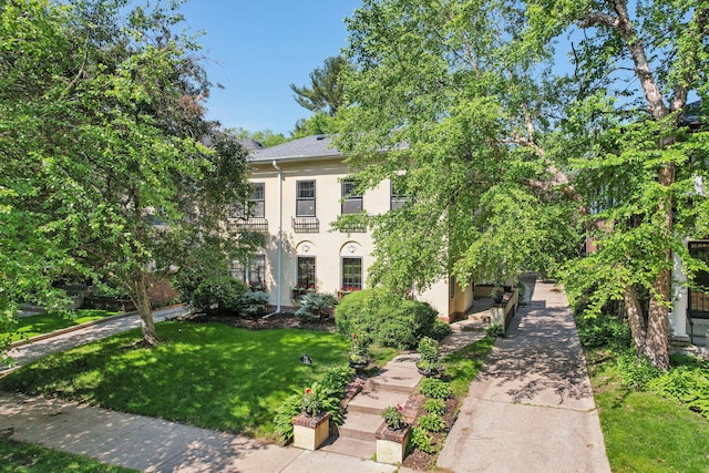 1770 James Ave S Unit 1, Minneapolis, MN 55403 - view of front of house with stucco siding and a front lawn