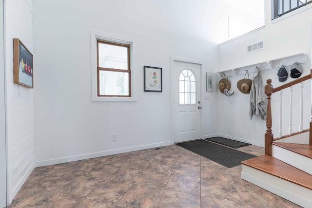 15126 Tumuli Rd, Dalton, MN 56324 - entryway with stairs, baseboards, and stone finish flooring