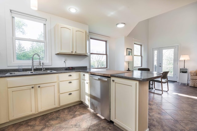 15126 Tumuli Rd, Dalton, MN 56324 - kitchen with dishwasher, a sink, cream cabinetry, a peninsula, and dark countertops