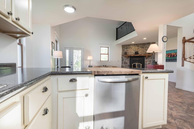 15126 Tumuli Rd, Dalton, MN 56324 - kitchen with dishwasher, white cabinets, open floor plan, a fireplace, and baseboards
