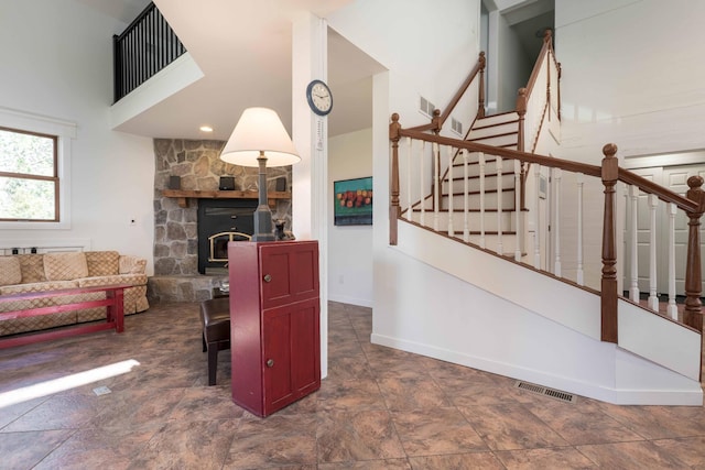 15126 Tumuli Rd, Dalton, MN 56324 - living area featuring stairs, baseboards, and a towering ceiling