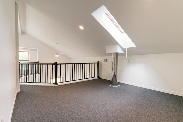 15126 Tumuli Rd, Dalton, MN 56324 - bonus room featuring a skylight, vaulted ceiling, baseboards, dark colored carpet, and recessed lighting