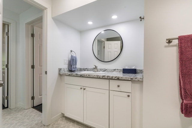 15126 Tumuli Rd, Dalton, MN 56324 - bathroom with vanity, recessed lighting, and baseboards