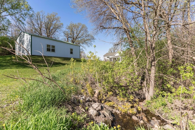 15126 Tumuli Rd, Dalton, MN 56324 - view of green lawn with an outbuilding