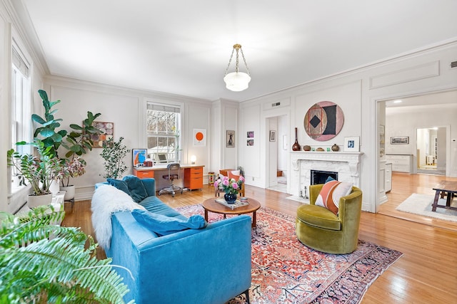 421 Summit Ave Unit 2, Saint Paul, MN 55102 - living room with a decorative wall, light wood finished floors, ornamental molding, an office area, and a high end fireplace