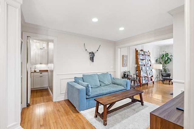 421 Summit Ave Unit 2, Saint Paul, MN 55102 - living room featuring light wood finished floors, ornamental molding, and recessed lighting