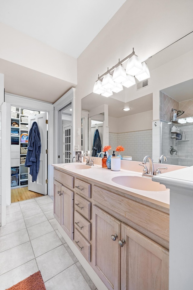 421 Summit Ave Unit 2, Saint Paul, MN 55102 - full bath featuring tile patterned floors, tiled shower, double vanity, and a walk in closet