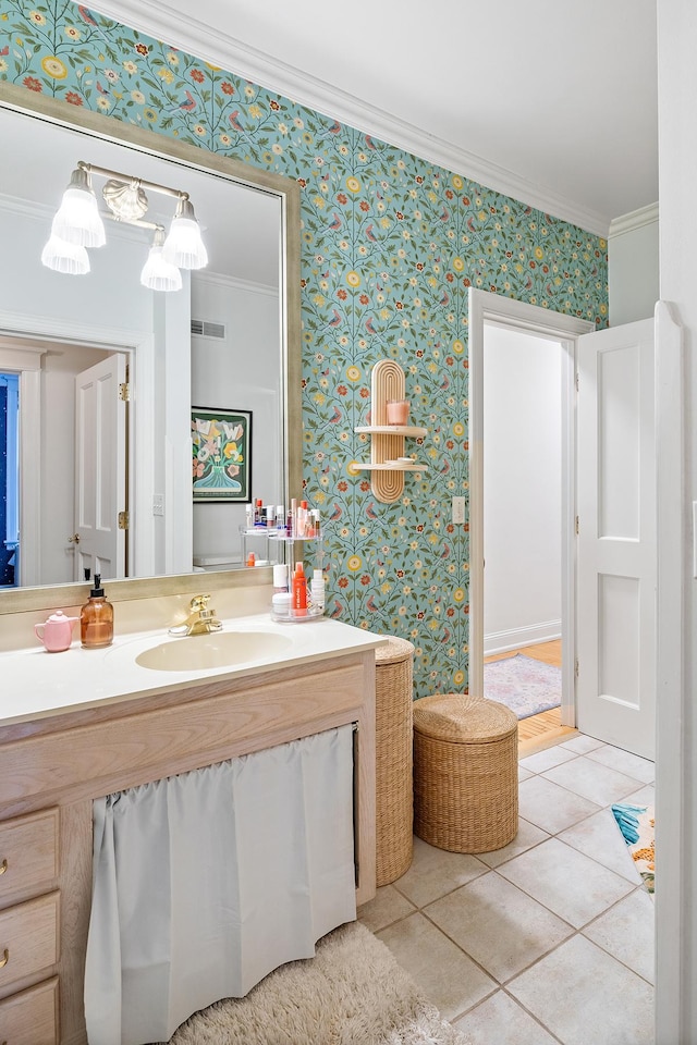 421 Summit Ave Unit 2, Saint Paul, MN 55102 - bathroom featuring crown molding, wallpapered walls, tile patterned floors, and vanity
