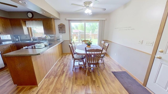 109 Gray Pl W, Marshall, MN 56258 - dining room with a ceiling fan, light wood finished floors, and baseboards