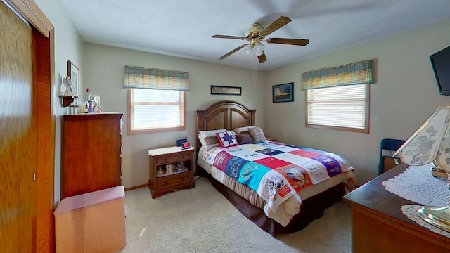 109 Gray Pl W, Marshall, MN 56258 - carpeted bedroom featuring multiple windows, a ceiling fan, and a closet