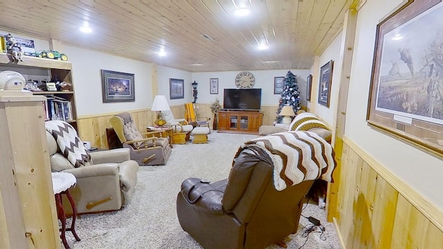 109 Gray Pl W, Marshall, MN 56258 - carpeted living room featuring wainscoting, wood ceiling, and wood walls