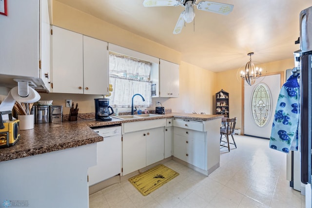 kitchen with a sink, white dishwasher, a peninsula, white cabinets, and ceiling fan