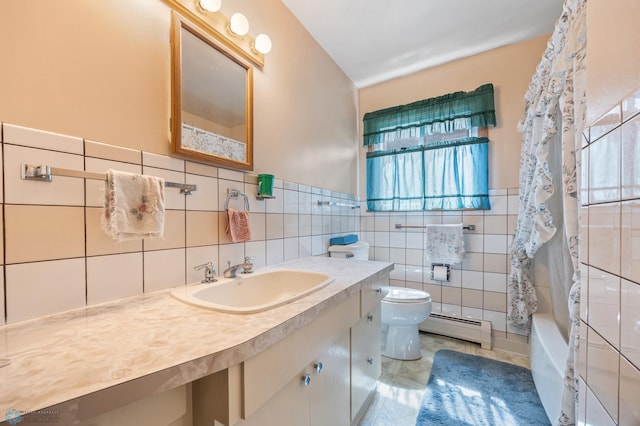 full bathroom featuring a baseboard heating unit, healthy amount of natural light, toilet, tile walls, and vanity