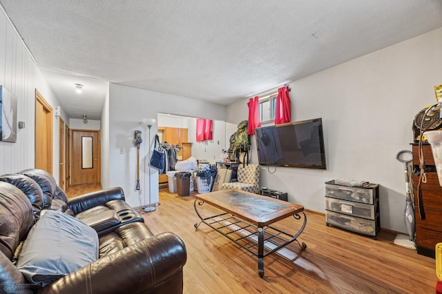 living room with wood finished floors and a textured ceiling