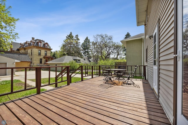 wooden terrace featuring outdoor dining space