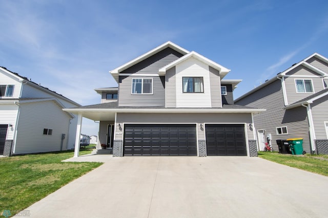 view of front of house with a garage, driveway, a front lawn, and brick siding