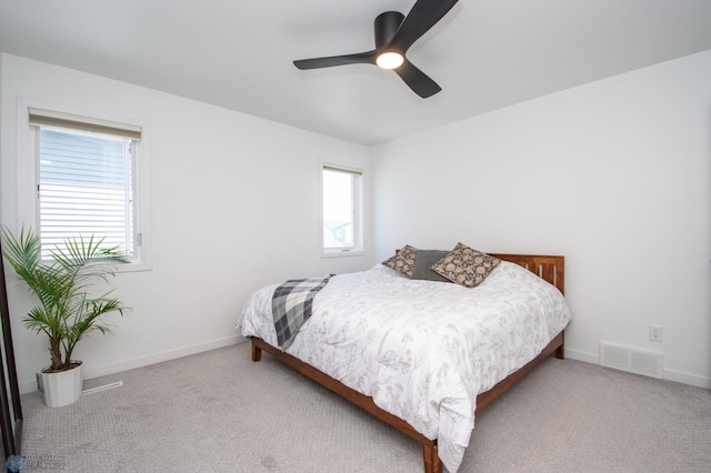 bedroom with carpet, baseboards, and a ceiling fan