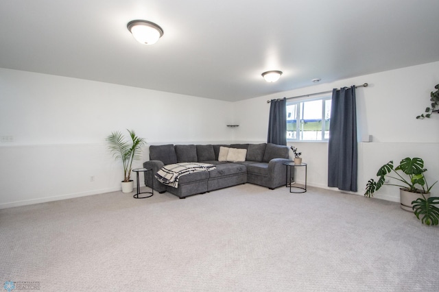 living room with light carpet and baseboards