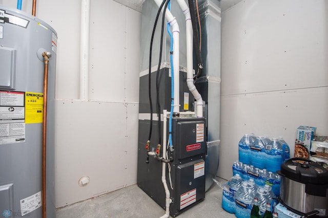 utility room featuring water heater and heating unit