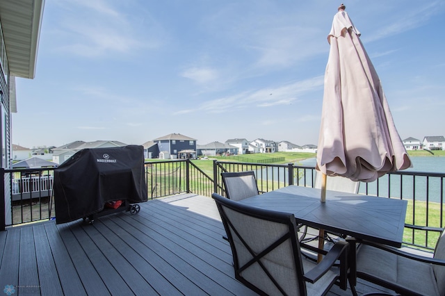 deck featuring a residential view and outdoor dining space