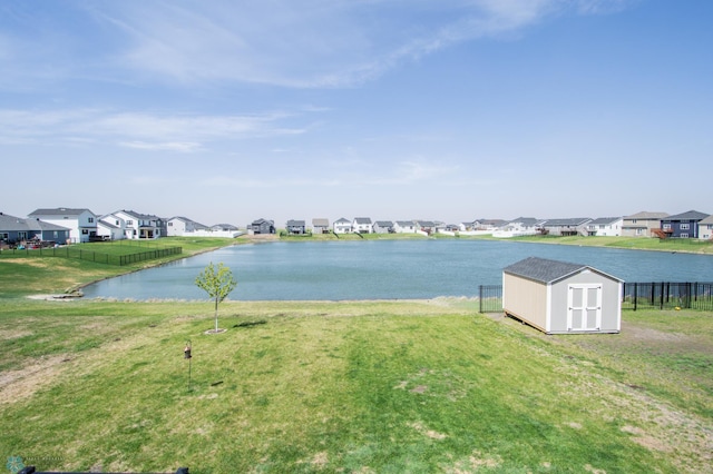 water view featuring nearby suburban area and fence