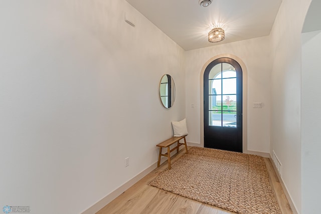 8820 Northern Lights Ave, Fargo, ND 58047 - entryway with arched walkways, light wood-style flooring, and baseboards