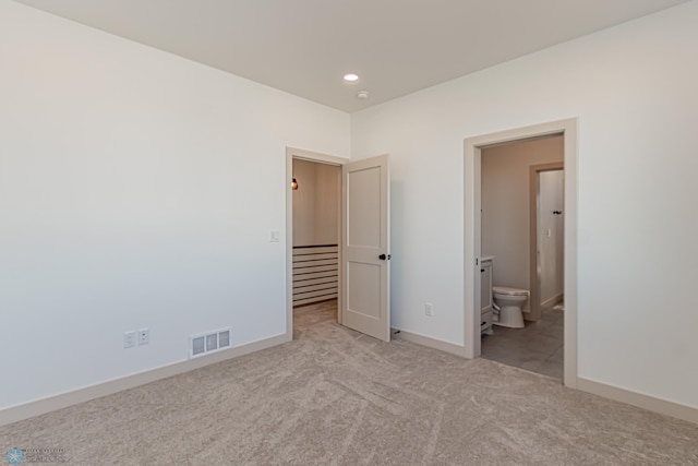 8820 Northern Lights Ave, Fargo, ND 58047 - unfurnished bedroom featuring carpet flooring, recessed lighting, baseboards, and connected bathroom